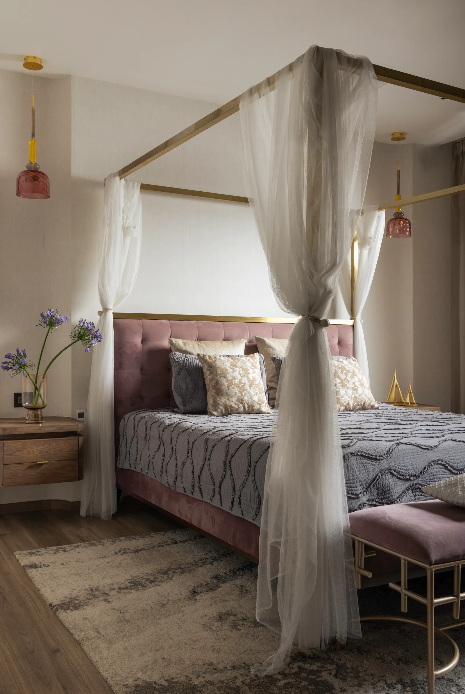 Canopy bed with sheer drapes and pink upholstery — Seema Katta Svasa